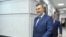 Russia -- Ukrainian former President Viktor Yanukovych walks towards the media after a video link with a Ukrainian court during the trial of former riot police force members, suspected of killing participants of the 2014 anti-government and pro-European U