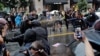U.S. -- Police officers use pepper spray towards counter-demonstrators during a white nationalist-led rally marking the one year anniversary of the 2017 Charlottesville ‘Unite the Right’ protests, in Washington, August 12, 2018